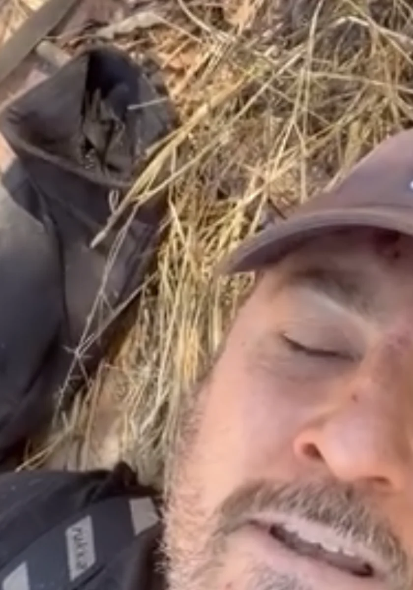 Aaron Hudson injured and awaiting evacuation after a remote motorcycle crash